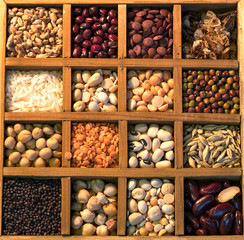 Lentils and pulses stored in a  wooden rack