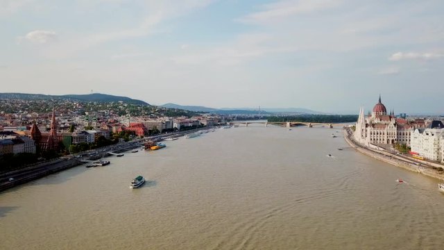 Aerial footage of Budapest, Hungary over the Danube river on a summer's day.