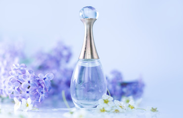small perfume and lilac flowers
