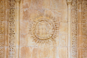 Christogram with the abbreviation 'IHS' on a wall of the Jerónimos Monastery in Lisbon, Portugal