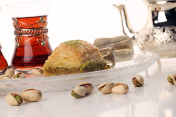 Middle eastern or arabic dishes. Turkish Dessert Baklava with pistachio on dishes