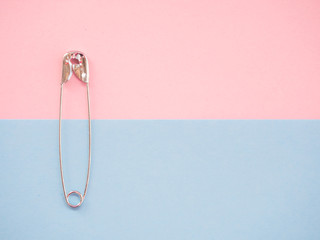 A safety pin representing the concept of loneliness