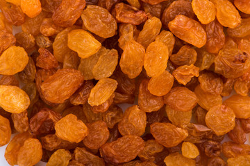raisins on a white background. dried grapes. raisins close up
