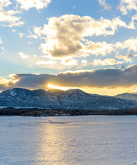 Winter Sunset - A winter sunset view of frozen Bear Creek Lake. Denver-Lakewood, Colorado, USA.