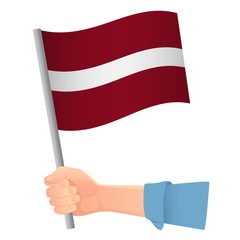 latvia flag in hand