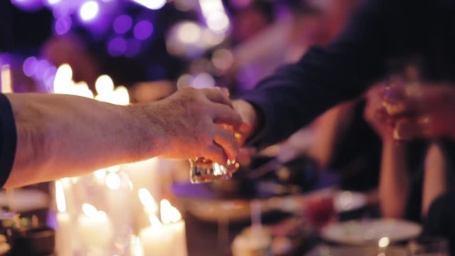 Festive table in a restaurant, people have dinner, celebration background