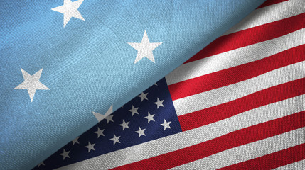 Obraz premium Micronesia and United States two flags textile cloth, fabric texture