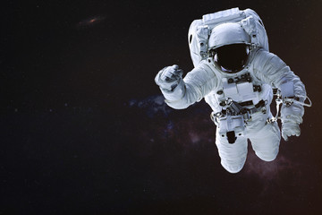 Fototapeta na wymiar Astronaut in outer space. Science fiction wallpaper. Elements of this image were furnished by NASA.