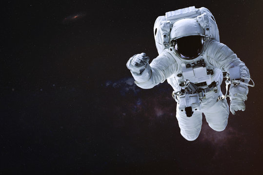 Astronaut in outer space. Science fiction wallpaper. Elements of this image were furnished by NASA.