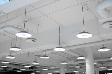 Shopping center led lighting. Ceiling lights in the mall. Ventilation and water pipes. Fire alarm system - 268242219