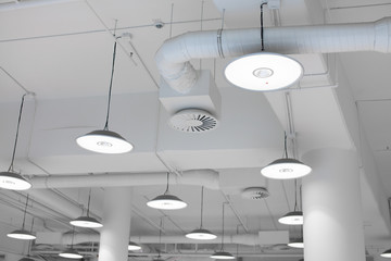 Shopping center led lighting. Ceiling lights in the mall. Ventilation and water pipes. Fire alarm system - 268242255