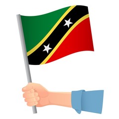 Saint Kitts and Nevis flag in hand