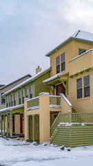 Clear Vertical Wet and snowy pathway in front of adorable homes in Daybreak Utah