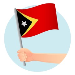East Timor flag in hand