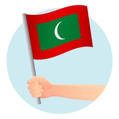 Maldives flag in hand