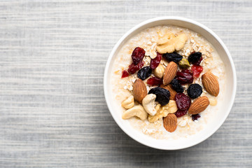Healthy breakfast fresh granola muesli with milk and nuts - obrazy, fototapety, plakaty