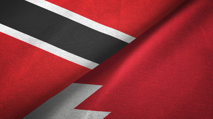 Fototapeta na wymiar Trinidad and Tobago and Bahrain two flags textile cloth, fabric texture 
