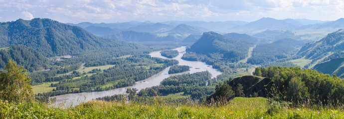 Tourism in Altay, Russia. View of the valley and the river from the mountain. Panoramic view.