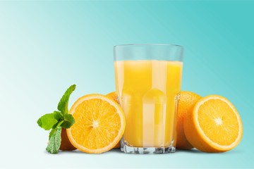 Orange juice and slices of orange on background