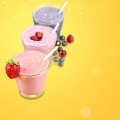Three Fruit Smoothies with Straws  Isolated on a White Background