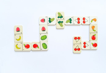 Montessori material for the study of mathematics. Natural material. Dominoes with fruit