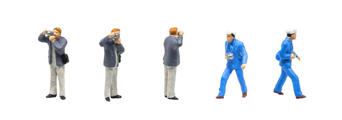 Miniature figurine character as photographer standing and working in posture isolated on white...