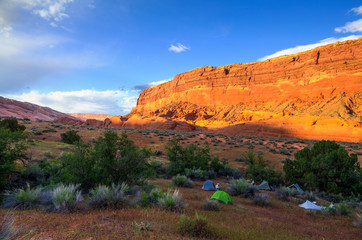 A group of backpackers camps in the  Waterpocket Fold along Halls Creek in Captiol Reef National Park.