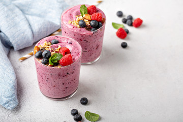 Fresh mixed berry smoothie topped with granola