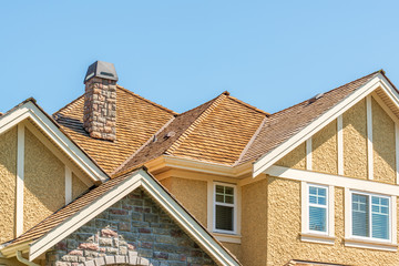 The top of the house or apartment building with nice window.