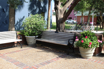 Wooden benches with flowers in the Amelia Island Historic District (Old Town), Fernandina Beach, Florida, USA 