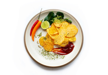 Crispy potato chips snack On a plate placed on a white background
