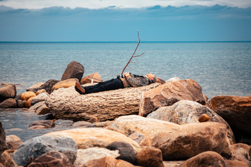 Fototapeta na wymiar Man resting by the water