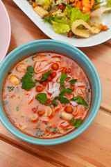 Vegetarian soup with vegetable broth, mushrooms and ribbon noodles as a diet lunch