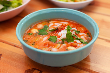 Vegetarian spicy soup with vegetable broth, mushrooms and ribbon noodles