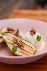 Sweet BBQ dessert: grilled pear with a nice scoop of vanilla ice cream