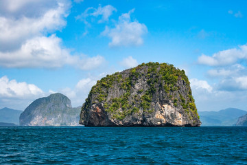Fototapeta na wymiar Small limestone round rock island in the region of El nido of the Palawan archipelago in the Philippines.