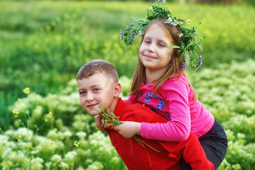 Cheerful children on a country walk . Friends in nature