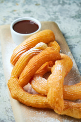 Churos spanish dessert. Gray textured background. Beautiful serving dishes. Dessert. Food chain