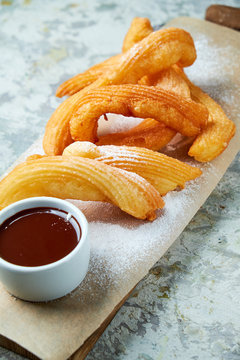 Churos spanish dessert. Gray textured background. Beautiful serving dishes. Dessert. Food chain