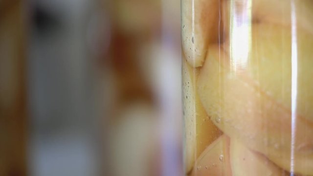 plums bottled and preserved close up focus pull