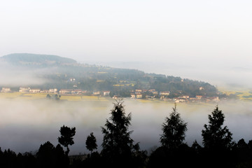 The mountain village in the morning mist