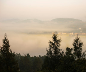 The mountain village in the morning mist