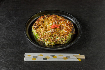 お好み焼き 広島焼き Okonomiyaki is a Japanese-style pancake