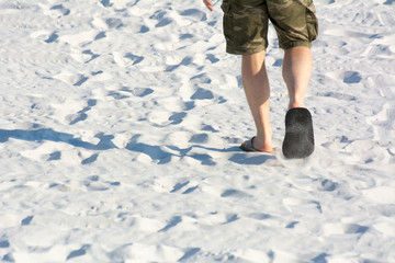 Man Walking Alone on White Sand Before Sunset. Destin, Florida