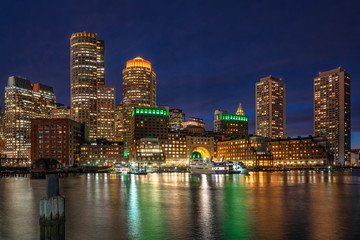 Fototapeta na wymiar Scene of Boston skyline from Fan Pier at the fantastic twilight time with smooth water river, Massachusetts, USA downtown skyline, Architecture and building with tourist concept