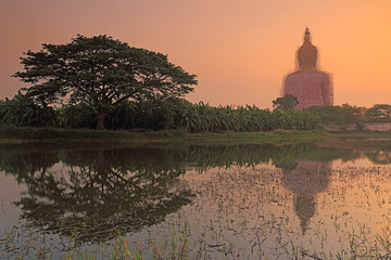 Obraz premium Beautiful view of big golden buddha at Wat Muang in during sunrise, Ang Thong province, Thailand 
