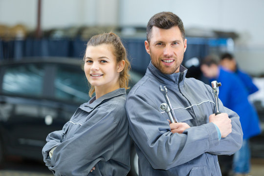 portrait of a mechanic and female trainee