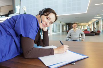 portrait of friendly female nurse looking at camera