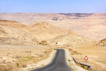 Stunning view of the Kings Highway, beautiful curvy road running through the Wadi Rum desert and canyons, Jordan.