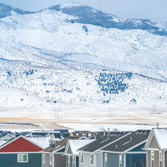 Clear Square Colorful houses against a breathtaking snow coated landscape in winter